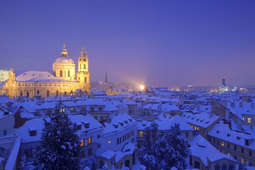 prague - st. nicolas church and rooftops of mala strana in winter