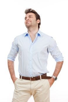 man in blue shirt and light trousers standing, looking - isolated on white