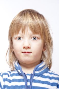 studio portrait of a boy with long blond hair - isolated on white