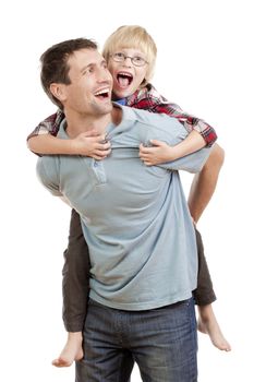 happy father giving his son piggy back ride - isolated on white