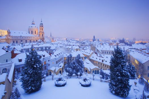 prague - st. nicolas church and rooftops of mala strana in winter