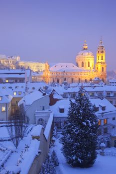 prague - st. nicolas church and rooftops of mala strana in winter