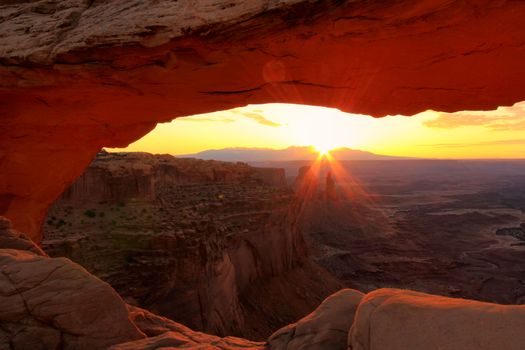 Glowing Mesa Arch at sunrise, Canyonlands National Park, Utah