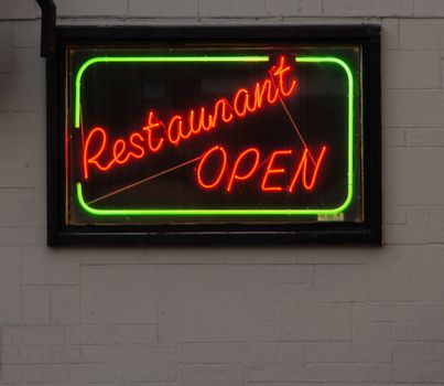 A neon sign, signifying an open restaurant