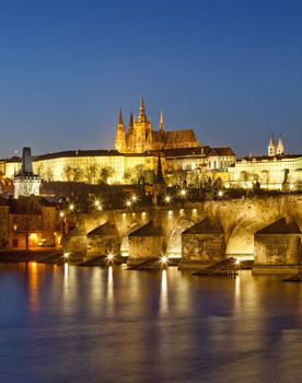 czech republic, prague - charles bridge and hradcany castle at dusk