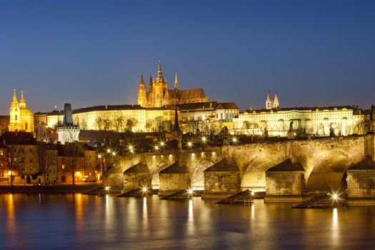 czech republic, prague - charles bridge and hradcany castle at dusk