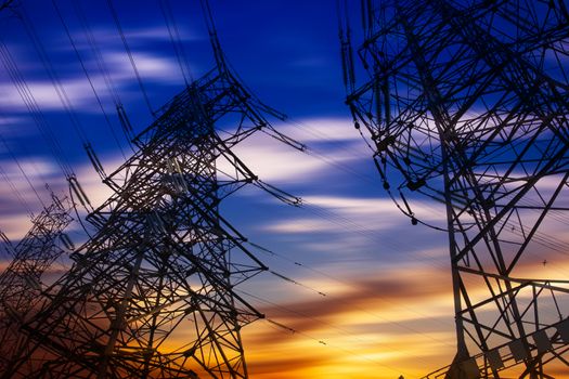 High voltage tower at sunset