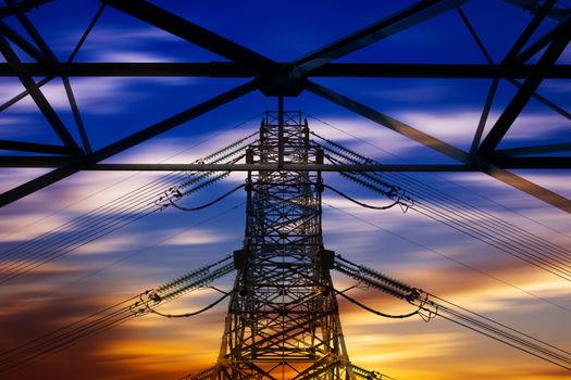 High voltage tower at sunset