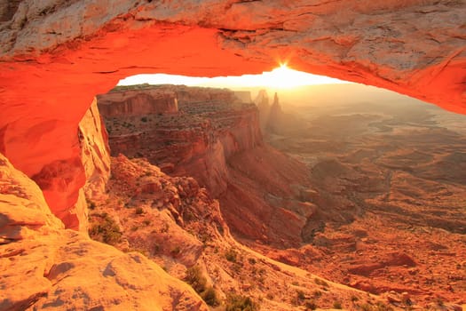 Glowing Mesa Arch at sunrise, Canyonlands National Park, Utah