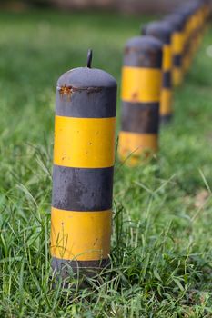 bollards in grassland in summer