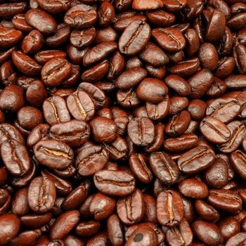Roasted coffee beans on wood. (Arabica coffee)
