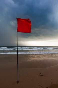 Severe storm warning flags on beach. Baga, Goa, India