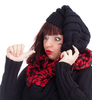 Young Woman with Black Cap Looking at her Thumb - Isolated on White