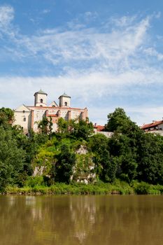 The Benedictine Abbey in Tyniec in Poland with wisla river on blue sky background