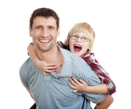 happy father giving his son piggy back ride - isolated on white