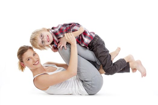 mother and son having fun enjoying time with each other - isolated on white