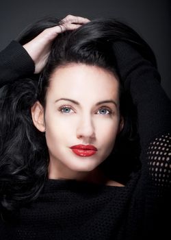 portrait of beautiful woman with dark hair and blue eyes