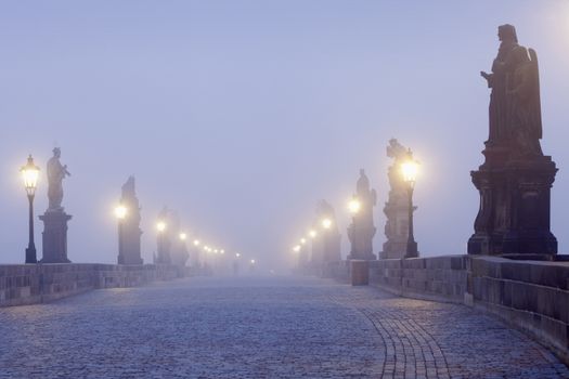 czech republic prague - charles bridge on foggy morning