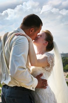 Beautiful the bride and the groom kiss