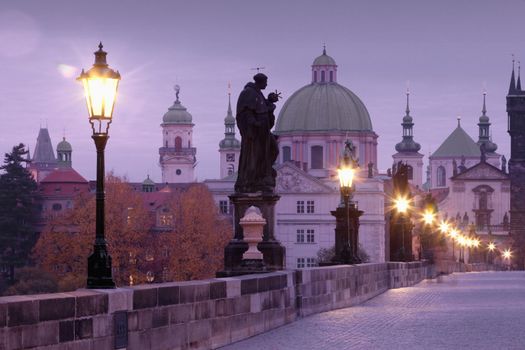 czech republic prague - charles bridge and spires of the old town at dawn