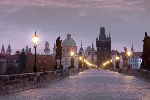 czech republic prague - charles bridge and spires of the old town at dawn