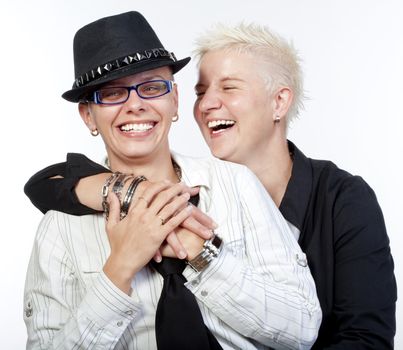 two lesbian woman with punk hairstyle laughing - isolated om white