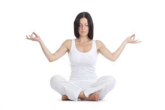 woman sitting on the floor exercising yoga - isolated on white