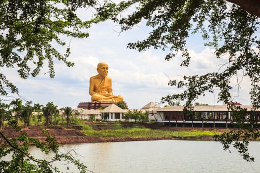 Giant statue of famous thai monk located in ayutthaya province, near the highway to northern thailand.