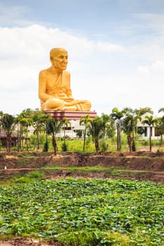 Giant statue of famous thai monk located in ayutthaya province, near the highway to northern thailand.
