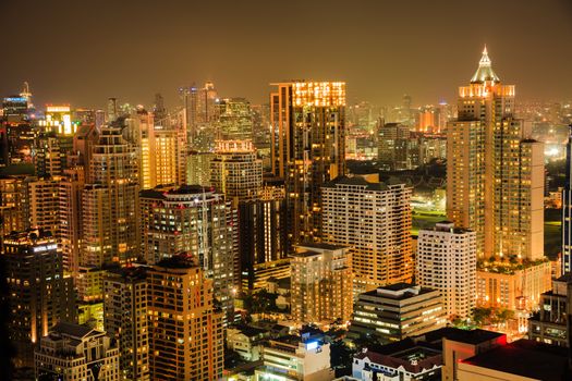 View of Bangkok skyline in the night. This picture was taken at the commercial center of Bangkok, Thailand.