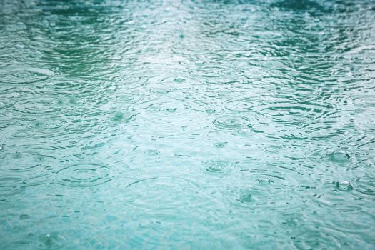 Raindrops at a water surface