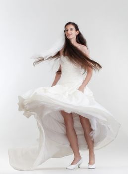 portrait of a bride with long dark hair in wedding dress