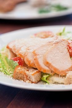 Chicken ceasar salad closeup photo