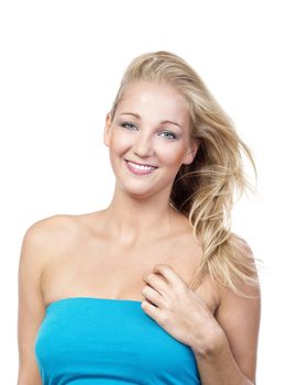 portrait of a young blond woman in blue top smiling - isolated on white