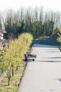 small street with a man and truck