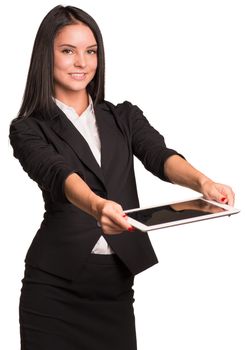 Beautiful businesswoman in suit holds tablet and looking at camera. Isolated on white background