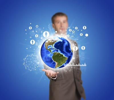 Businessman in suit hold Earth with graphs and network. Elements of this image are furnished by NASA