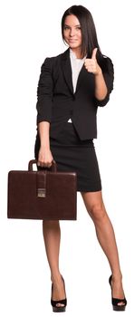 Beautiful businesswomen in suit hold briefcase and showing thumb-up. Isolated on white background