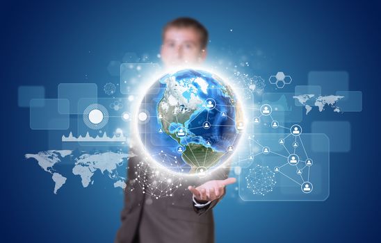 Businessman in suit hold Earth with graphs and network. Elements of this image are furnished by NASA