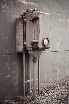 The old machinery instrument beside the wall