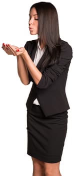 Beautiful businesswoman blowing in empty hands. Isolated on white background