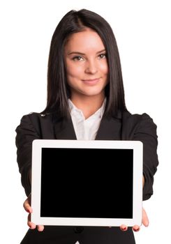 Beautiful businesswomen in suit showing tablet pc. Isolated on white background