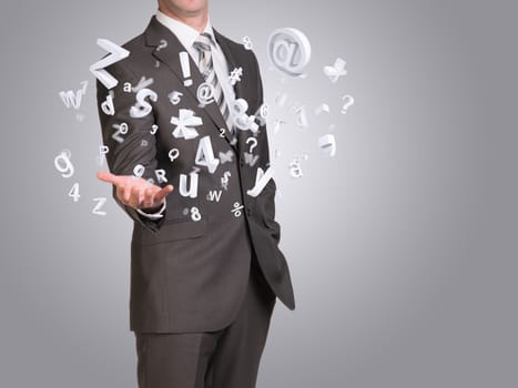 Businessman in suit hold empty hand with flying figures. Blue background