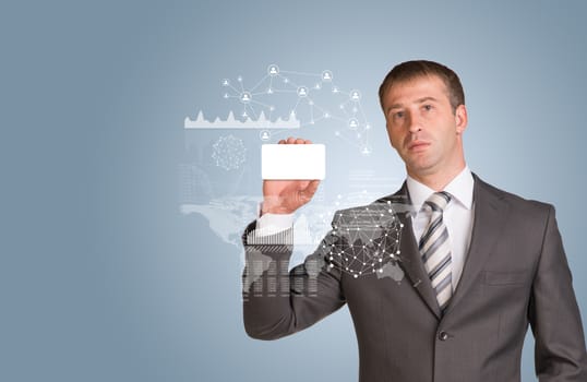 Businessman in suit hold empty white card in hand. Blue background