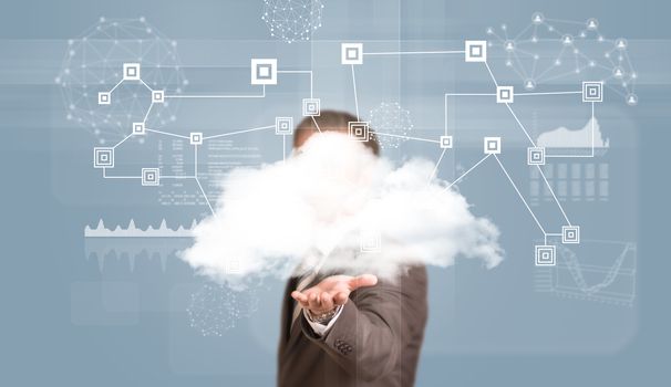 Businessman in suit hold cloud. Network and graphs as backdrop