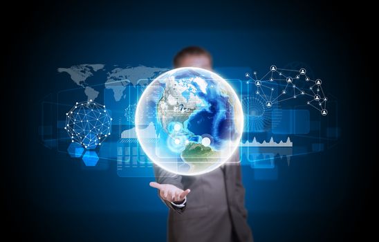 Businessman in suit hold Earth with graphs and network. Elements of this image are furnished by NASA