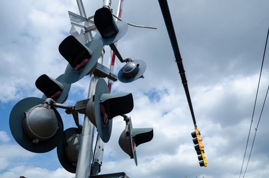 Railroad crossing sign against blue sky background