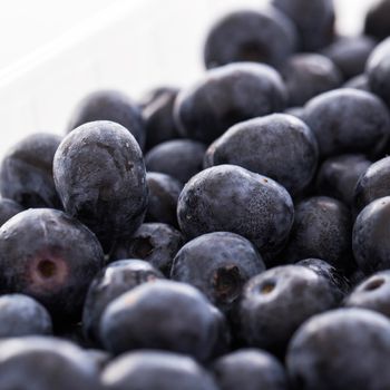 Picture of lots of blueberries over a white background