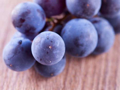 Black grape over table, strict close up