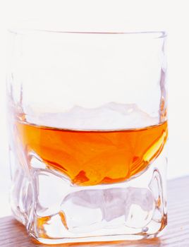 Whisky in a small shot, white background